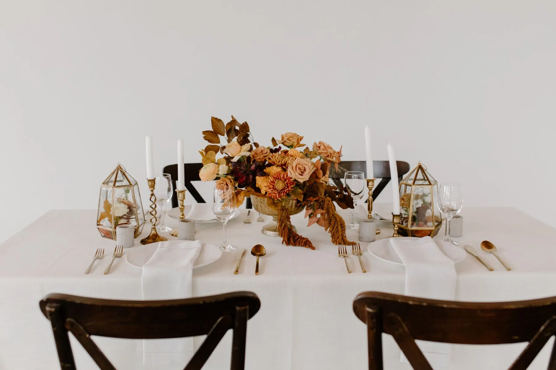 Gold-accented place setting for a formal dinner