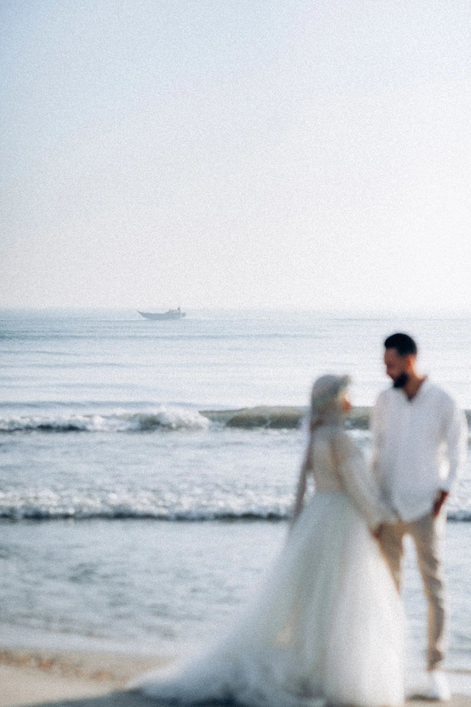 Muslim couple at a beach wedding ceremony