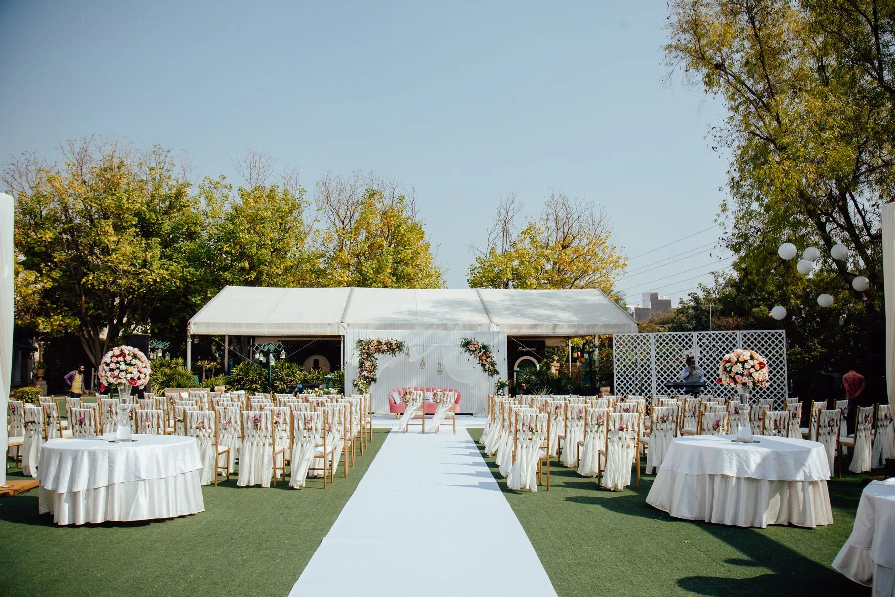 Elegant outdoor wedding tent in a green landscape