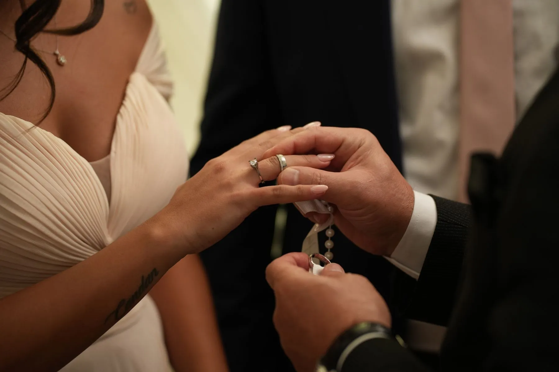 Close view of a ring exchange during a ceremony