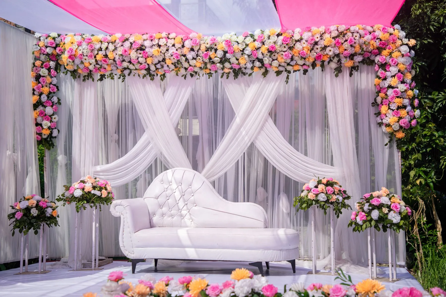 Colourful South Asian floral wedding stage