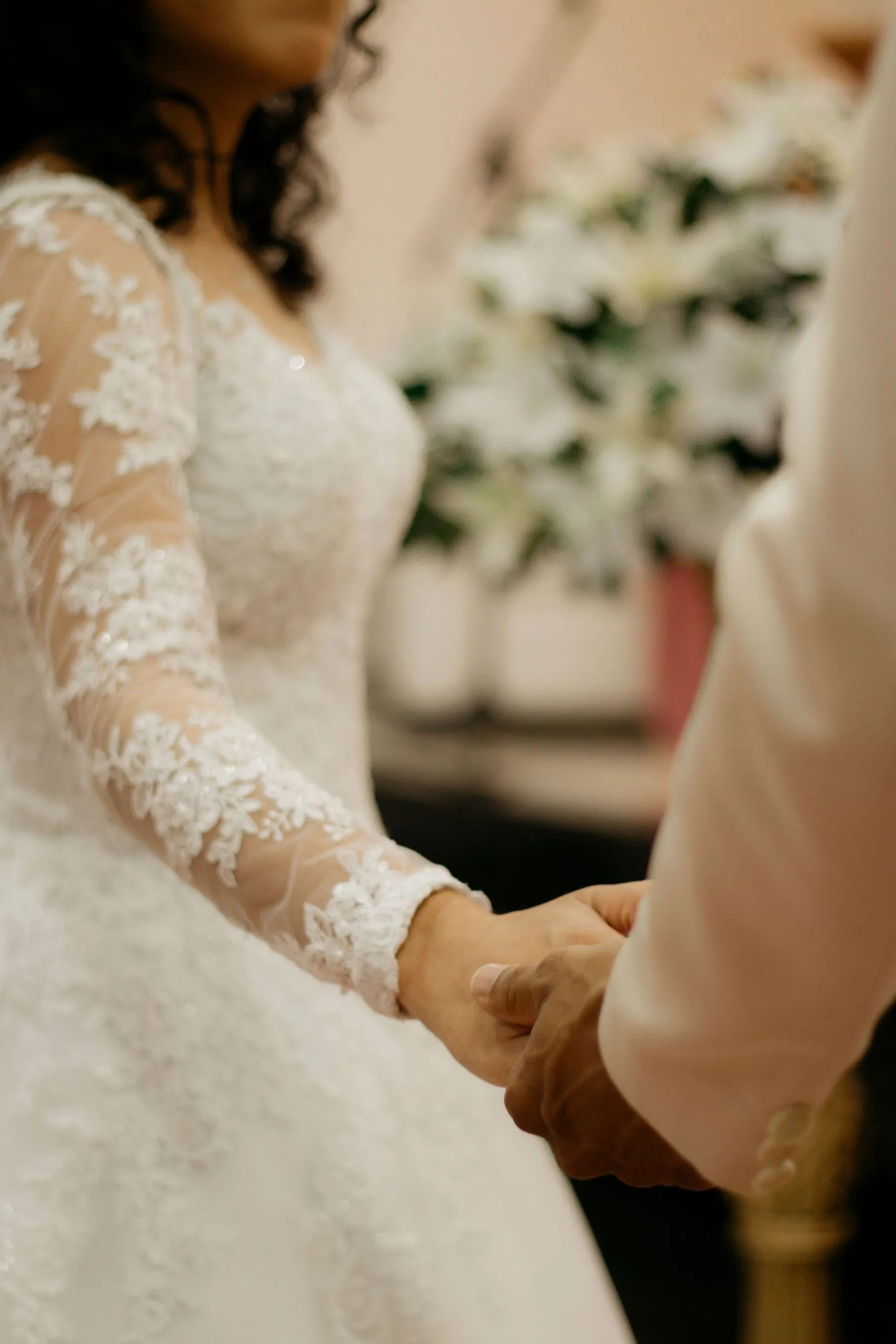 Hands held during a wedding ceremony