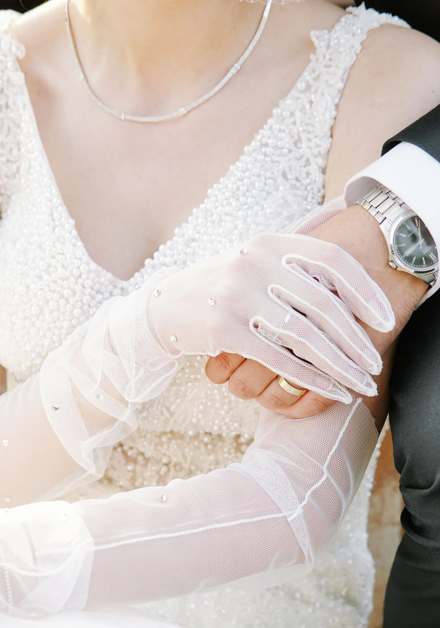Close detail of a couple holding hands
