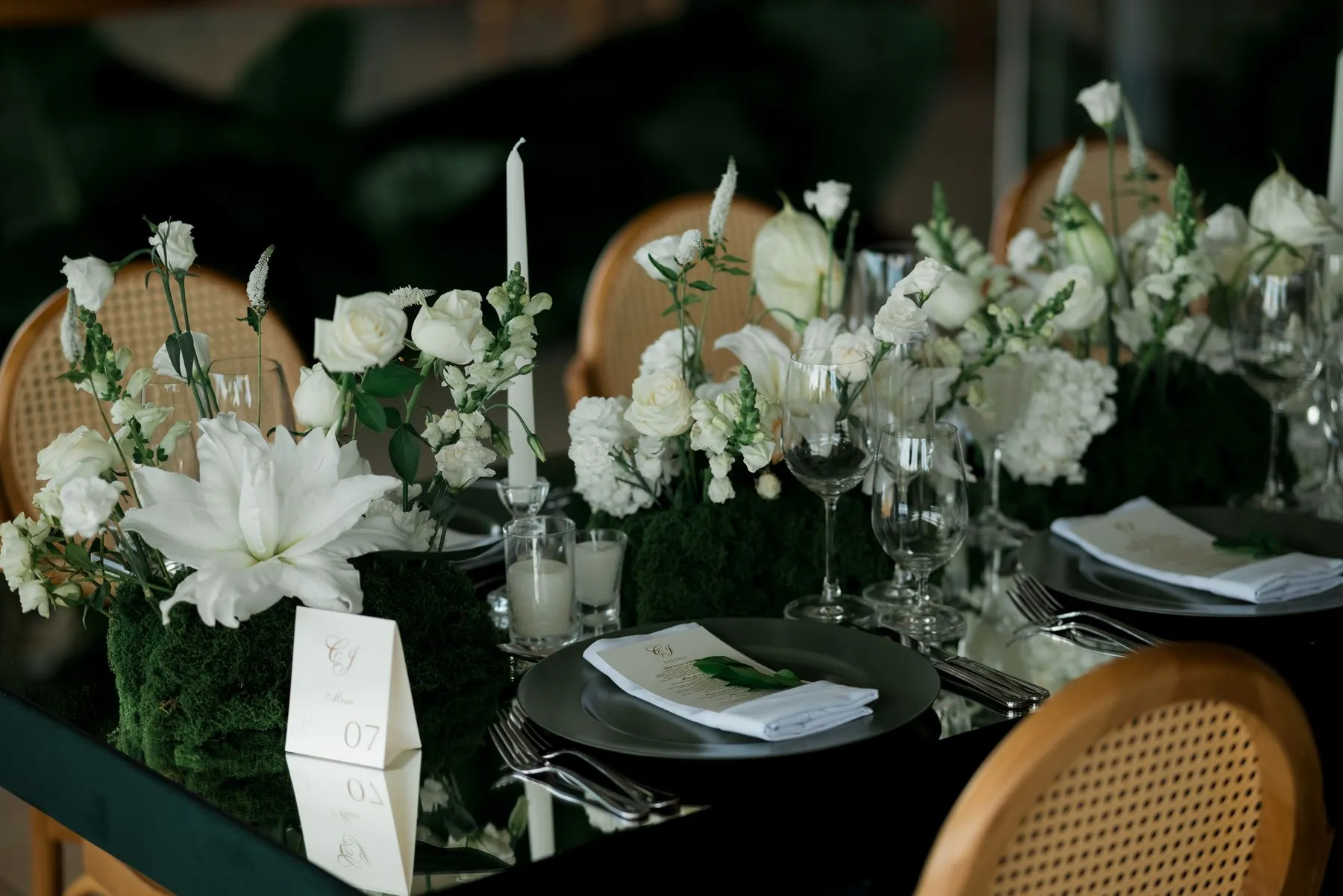 White rose centrepiece on a reception table